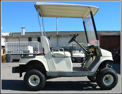 Golf car with lift kit and larger tyres